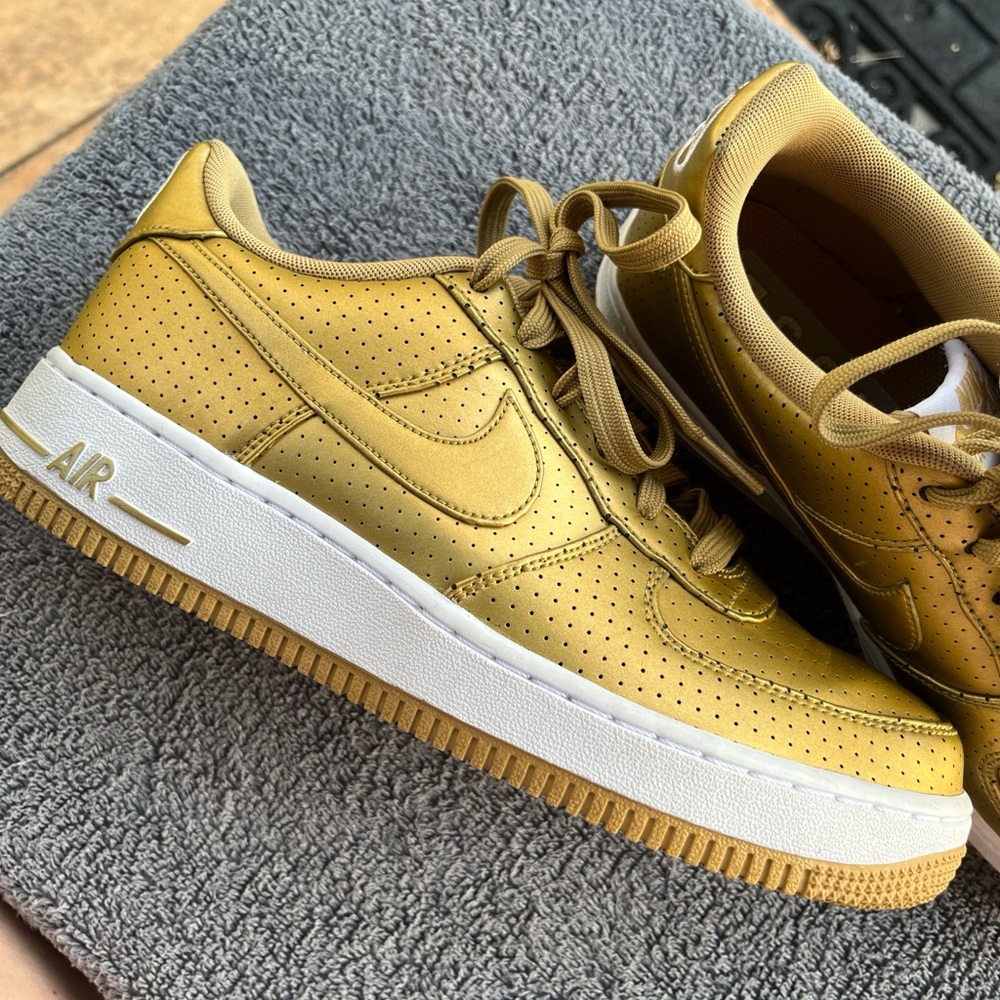 Nike Air Force 1 '07 LV8 Low sneakers in the "Metallic Gold/White"